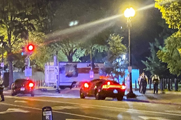 Image: A truck is seen crashed into a security barrier at a park across from the White House on May 22, 2023.