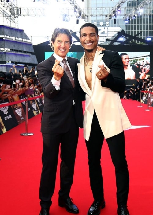 Greg Tarzan Davis (Right) posing for the camera alongside Tom Cruise in Seoul, South Korea in June 2022