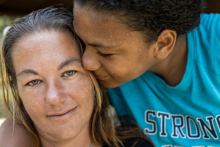 Tia Mosley with her daughter. Mosley's 17-year-old son Caleb was killed two years ago in a drive-by shooting.