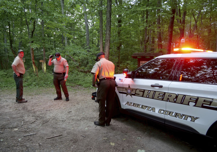 Authorities secure the entrance to Mine Bank Trail, an access point to the rescue operation along the Blue Ridge Parkway where a Cessna Citation crashed over mountainous terrain near Montebello, Va., on June 4, 2023.