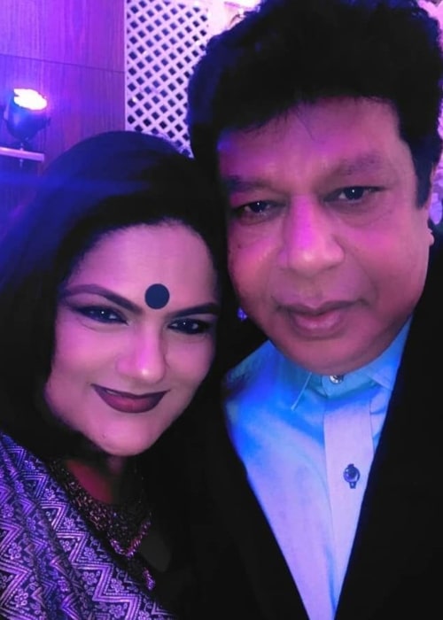 Guddi Maruti smiling in a selfie with her husband in 2022