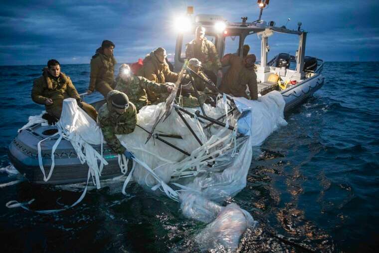 U.S. Navy sailors recover a high-altitude surveillance balloon off the coast of Myrtle Beach, S.C. on  Feb. 5, 2023.