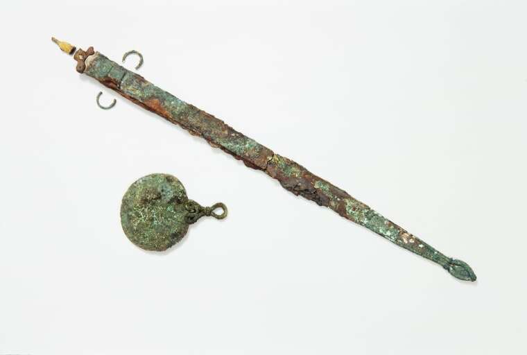 An Iron Age sword and mirror found the Bryher burial site.