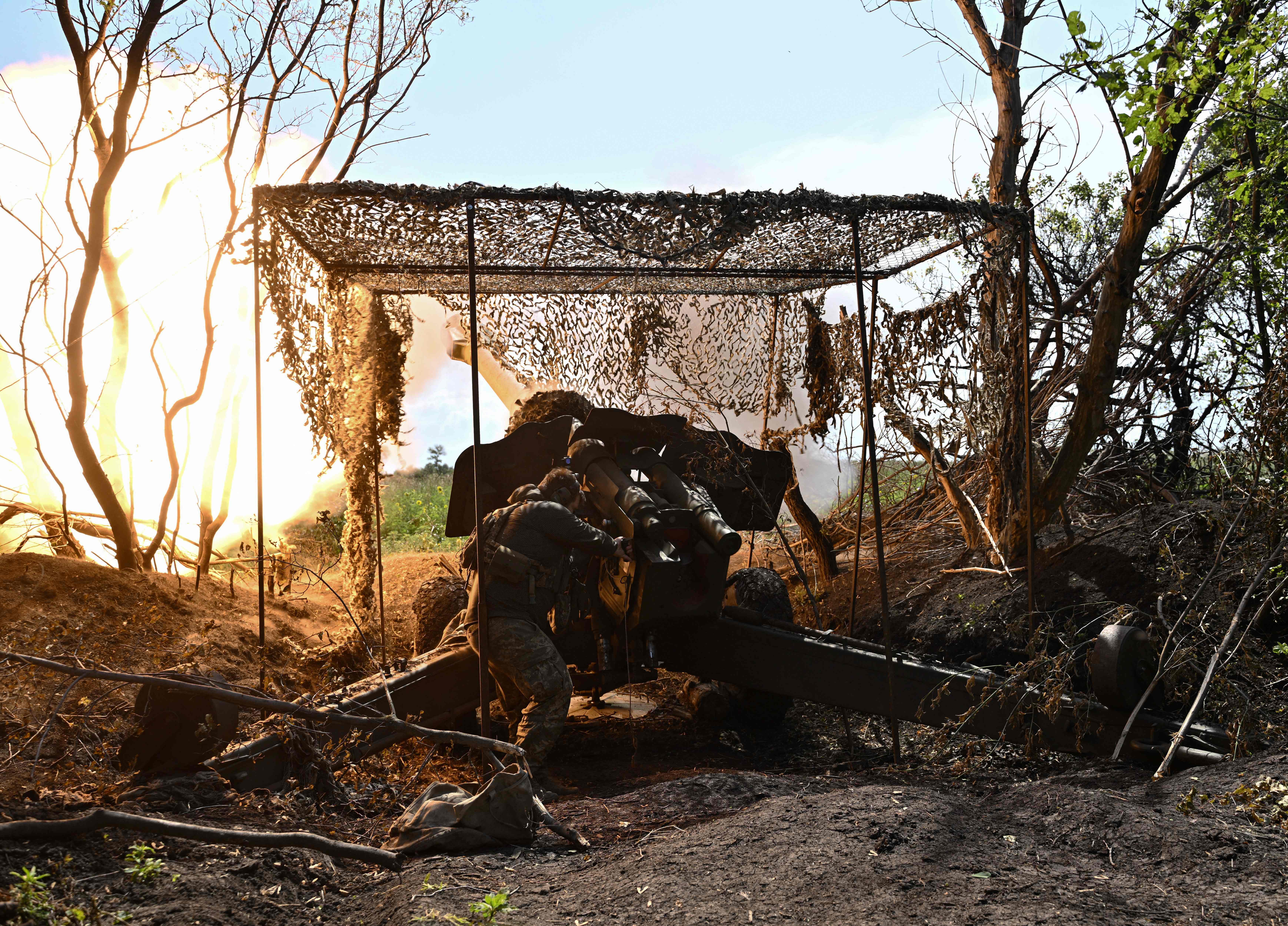 <p>A Ukrainian artilleryman fires a 152 mm towed gun-howitzer D-20 at Russian positions on the front line near Bakhmut, eastern Ukraine</p>