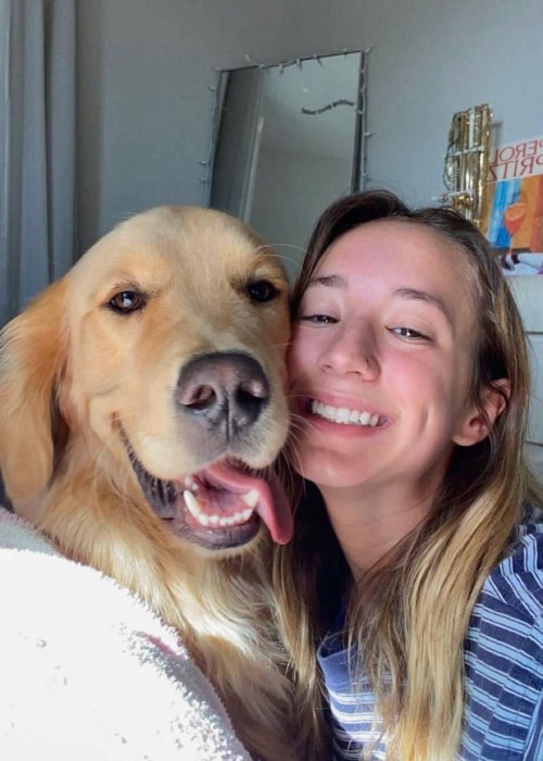 Abbey Bankson as seen in a selfie with a golden retriever that was taken in October 2022
