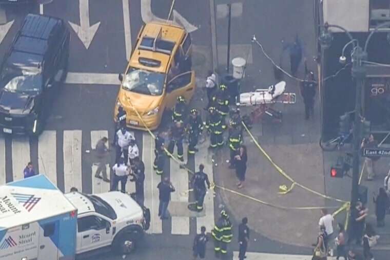Emergency crews respond to the scene of a crash in New York on Aug. 1, 2023, that injured 10 people.