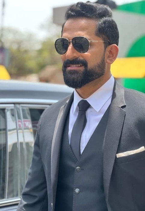 John Kokken as seen while smiling in a still in Hyderabad, Telangana in January 2023