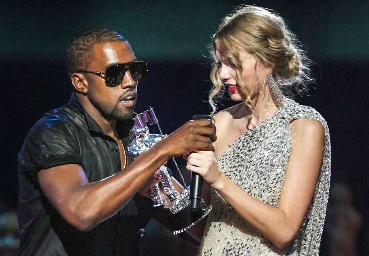 Image: Kanye West takes the microphone from singer Taylor Swift as she accepts the "Best Female Video" award during the MTV Video Music Awards in New York on Sept. 13, 2009.
