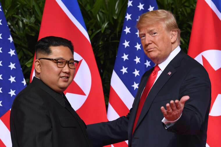 President Donald Trump meets with North Korea's leader Kim Jong Un at the start of their  summit in 2018.