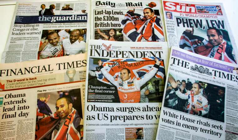A selection of the front pages of Britian's national papers in London, on Nov. 3, 2008, showing the new Formula One Champion Lewis Hamilton celebrating in Sao Paulo, Brazil.