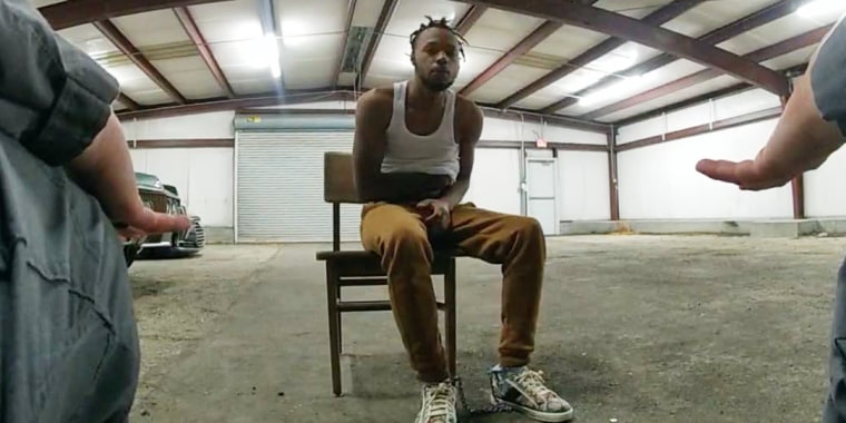 Baton Rouge police officers
question Jeremy Lee at the warehouse they reportedly call the "Brave Cave."