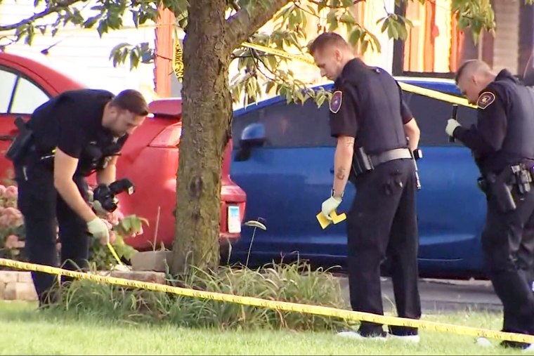 Police officers investigate the scene in Romeoville, Ill., on Sept. 18, 2023.