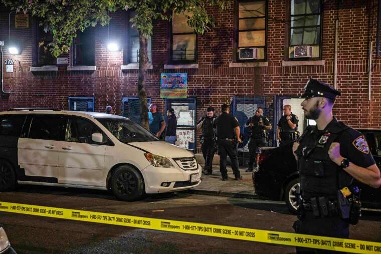 Police investigators at a day care in the Bronx, after a 1-year-old boy died and three other young children were hospitalized on Friday Sept. 15, 2023. (Dave Sanders/The New York Times)
