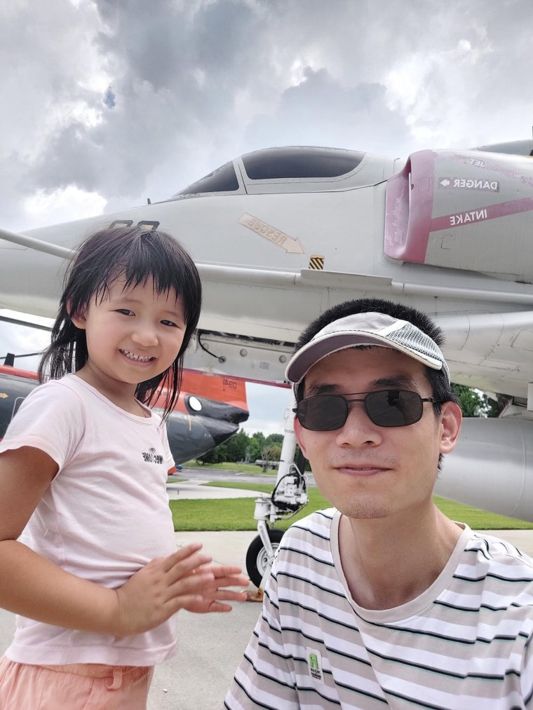 Zijie Yan with his daughter.
