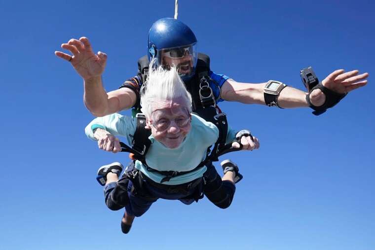 Dorothy Hoffner, 104, falling through the air with tandem jumper Derek Baxter