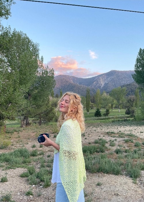 Julia Schlaepfer smiling for a picture while enjoying her time in the mountains in May 2023