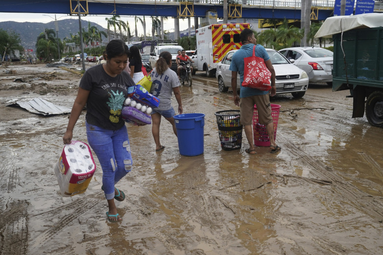 People loot a grocery store in Acapulco