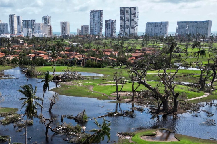 A golf course surrounded by debris is pictured in the aftermath of hurricane Otis at "Punta Diamante" in Acapulco, Guerrero State, Mexico, on Oct. 27, 2023. 