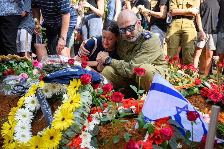 riends and family pay their respects at the joint funerals of Dana and Carmel Becher