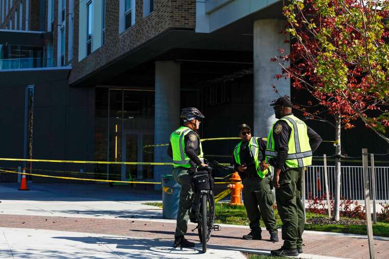 Police officers stand at Thurgood Marshall Hall at Morgan State University