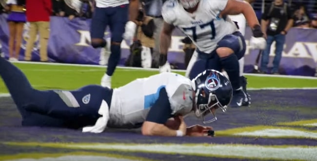 Ryan Tannehill pictured with the Tennessee Titans as he rushes for a touchdown during a game against the Baltimore Ravens in January 2020