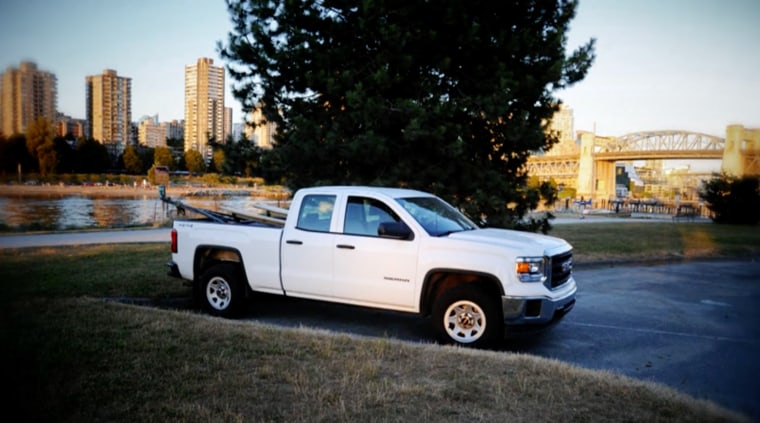 A 2014 GMC Sierra at a seaside parking lot in Vancouver.