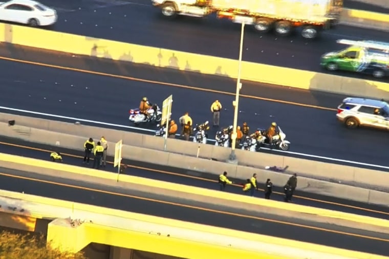 Police at the scene where two state troopers were were struck by a car while on duty and died Thursday morning.