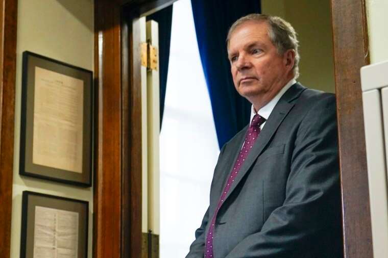 David Scanlan leans against a door frame in his office