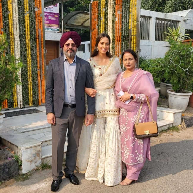Karman Kaur Thandi as seen in a picture with her parents in November 2023
