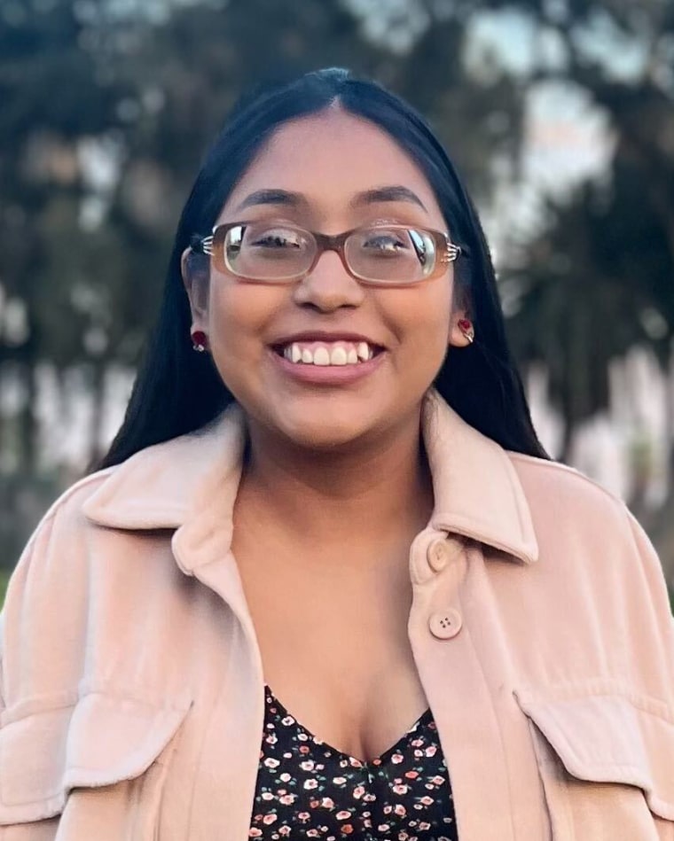 A portrait of Janet Ortigoza smiling.