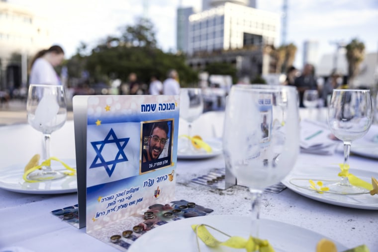 A photo of Alon Shamriz at a table in "hostage square