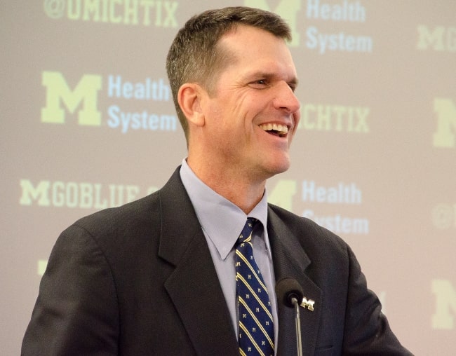 Jim Harbaugh as the head coach of the Michigan Wolverines football team in December 2014