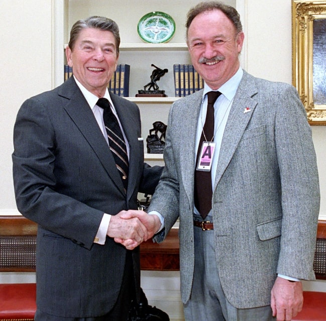 Gene Hackman (Right) as seen while posing for a picture with President Ronald Reagan in Oval Office in 1987