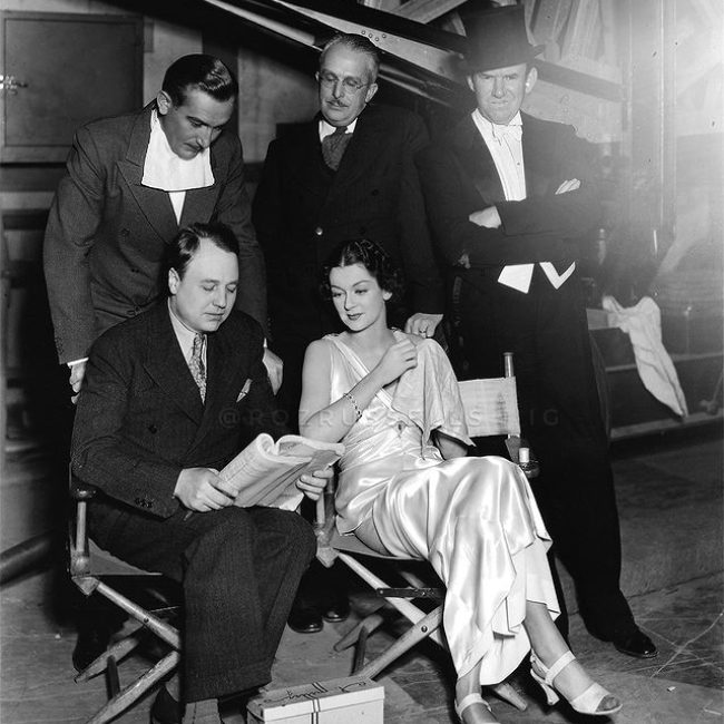 (Clockwise from left standing) Paul Lukas, Purnell Pratt, Ted Healy, Rosalind Russell, and Donald Cook as photographed together in a picture taken in the 1930s
