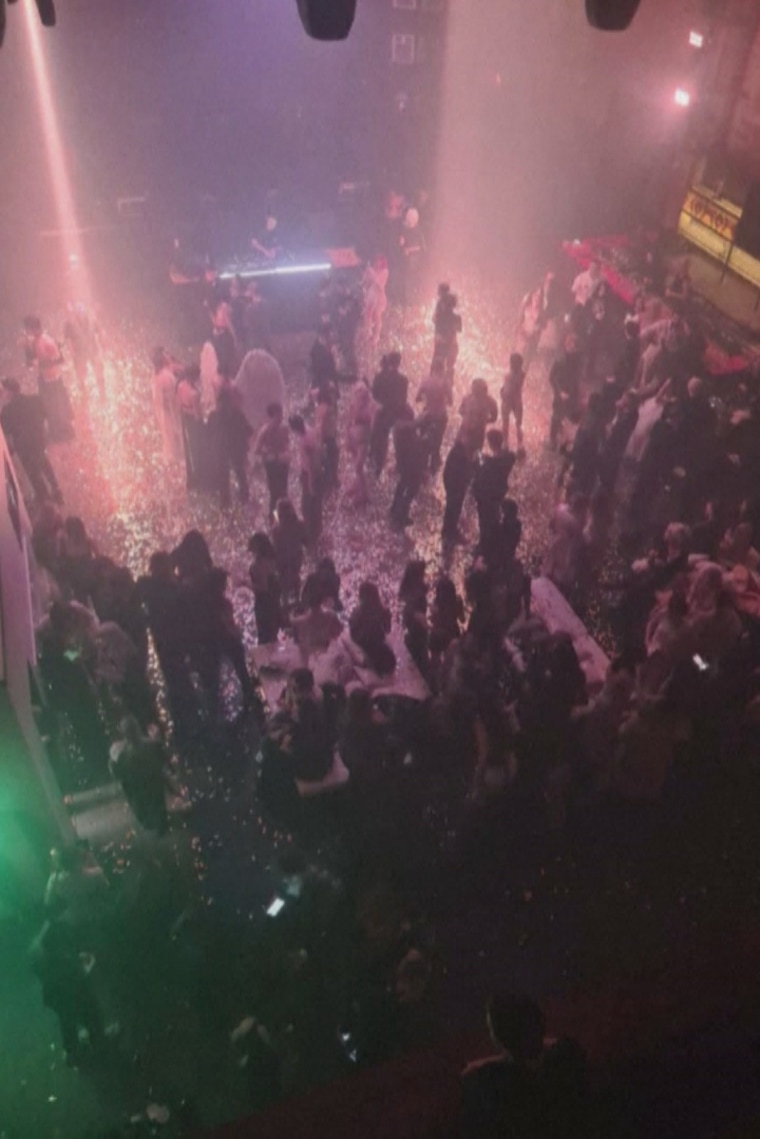 Guests attend an "almost-naked" party