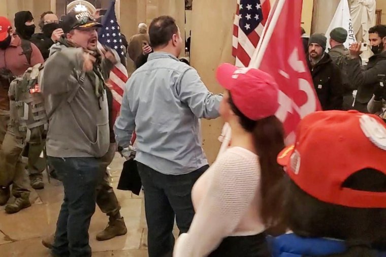 Miles Adkins, left, at the Capitol on Jan. 6, 2021.