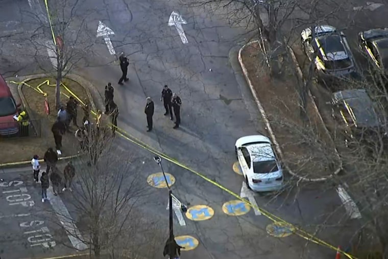Police at the lower campus parking lot outside Benjamin E. Mays High School.