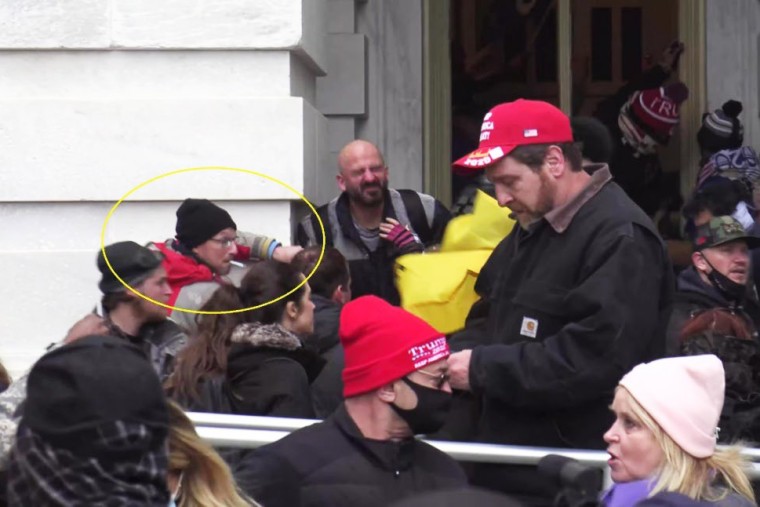Joseph Fisher smokes a cigarette outside the Capitol.