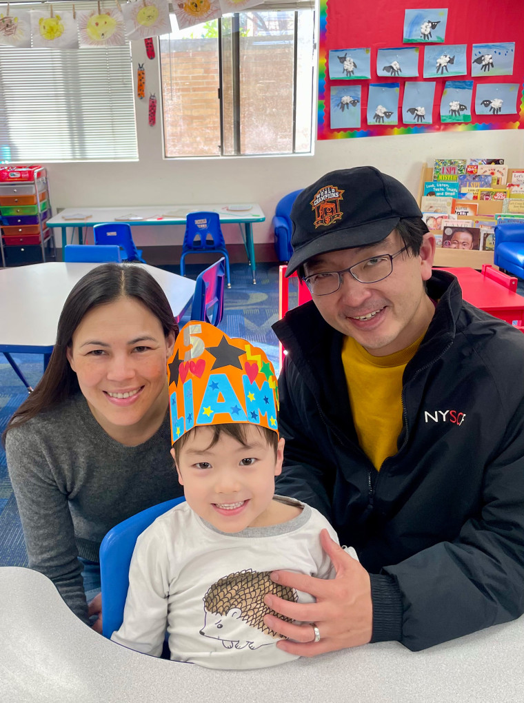 Liam with his parents Annie and Kevin on his 5th birthday.
