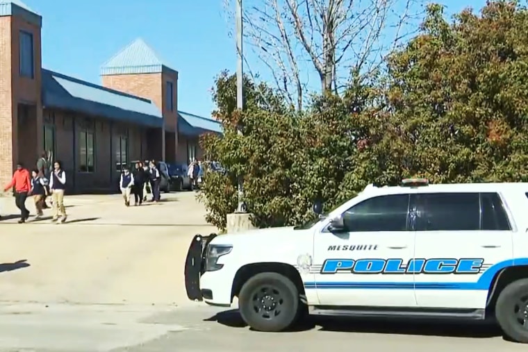 Students walk out of  Pioneer Technology & Arts Academy in Mesquite, Texas on Monday.