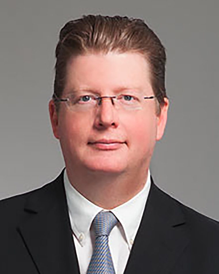 The executive director of the Bill and Hillary Clinton Airport in Little Rock, Arkansas, was shot Tuesday as federal agents arrived at his home to serve a search warrant, police said.