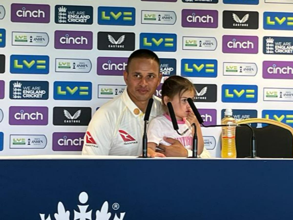 Ashes hero Usman Khawaja does press conference with daughter on his lap