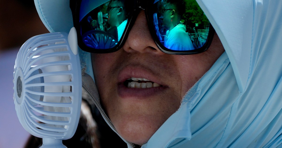 9 missing in China landslide sparked by heavy rains as temperatures soar