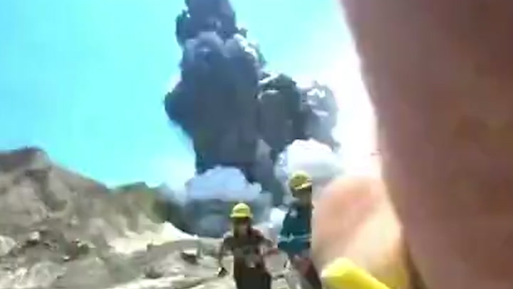 Tourists flee crater of erupting New Zealand volcano that killed 22 in never-before-seen video