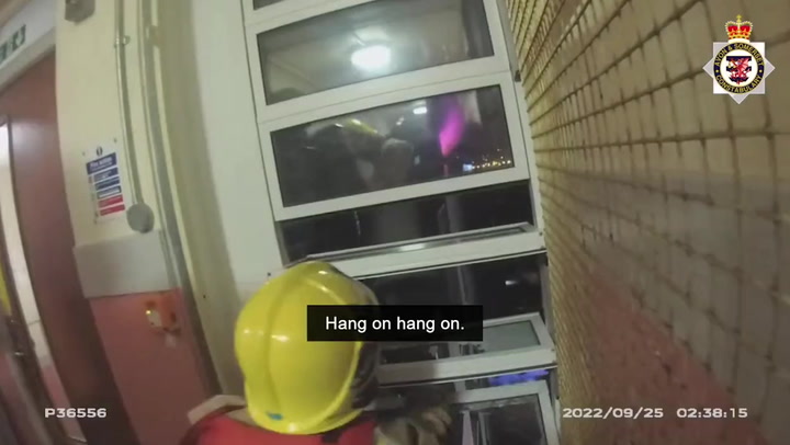 Men hanging from ledge of burning Somerset tower block rescued by firefighters