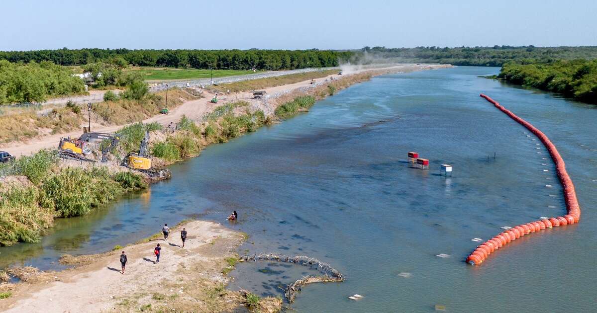 Justice Department threatens to sue Texas over migrant buoys