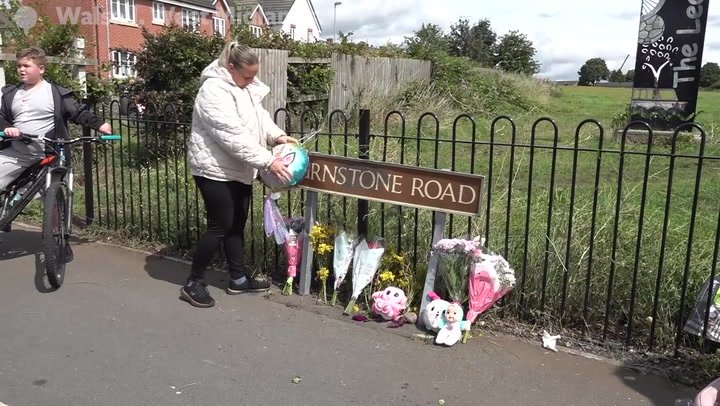 Tributes at scene where seven-year-old girl killed in hit and run as boy, 14, arrested