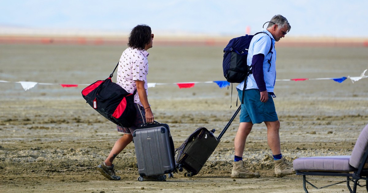 Burning Man crowd stuck in muddy venue, but there's 'no cause for panic,' CEO says.