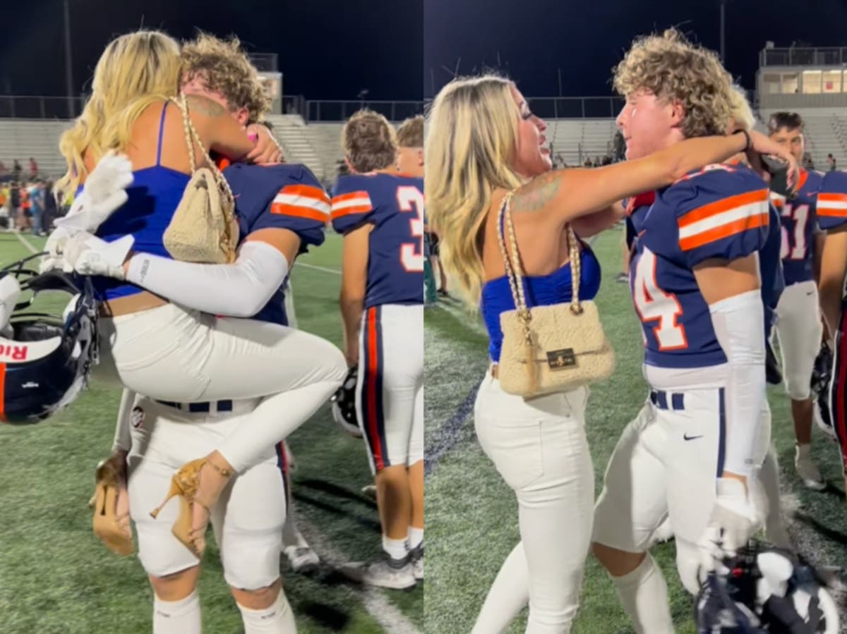 Mother responds to backlash over image of her hugging teenage son at football game