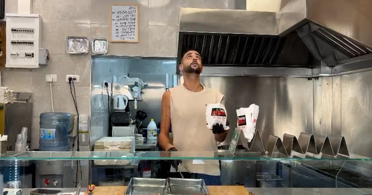 Israeli falafel shop worker juggles iconic street food